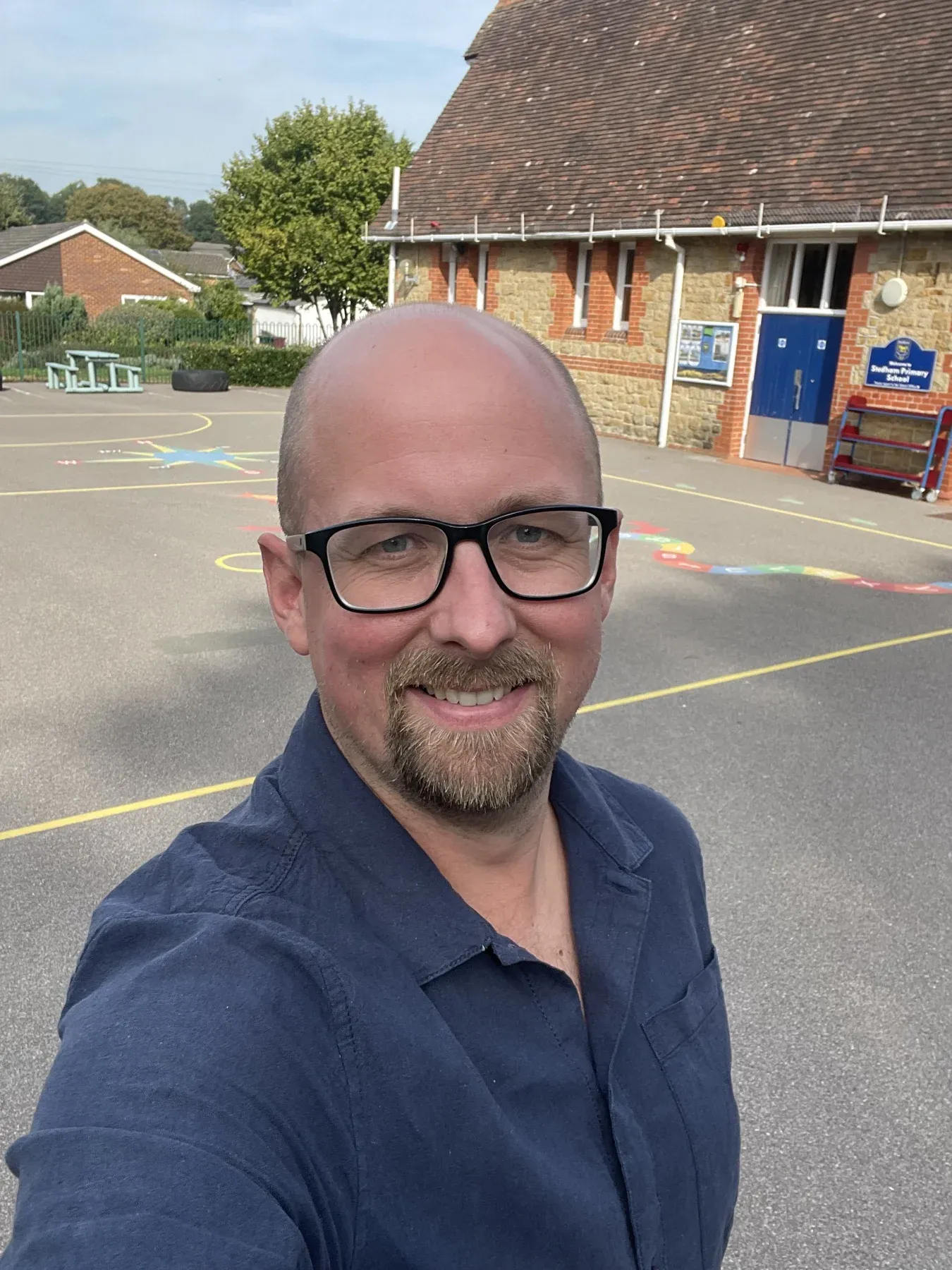 Mr Tidey, Headteacher, in the school playground